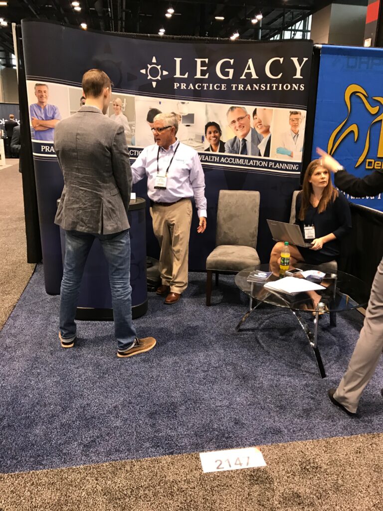 Legacy team engaging with peers at the Chicago Dental Society Mid Winter Meeting, highlighting industry involvement.