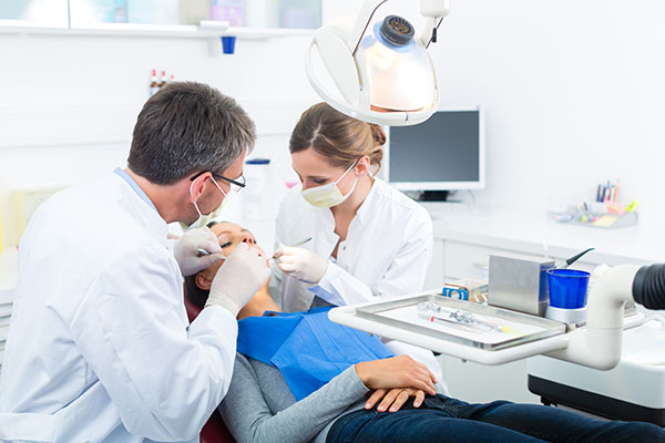 Team dental procedure in progress with patient