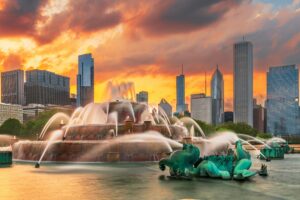 Fountain in a park with the Chicago skyline in the background, illustrating the vibrant community and opportunities for dental practices with Legacy Practice Transitions.